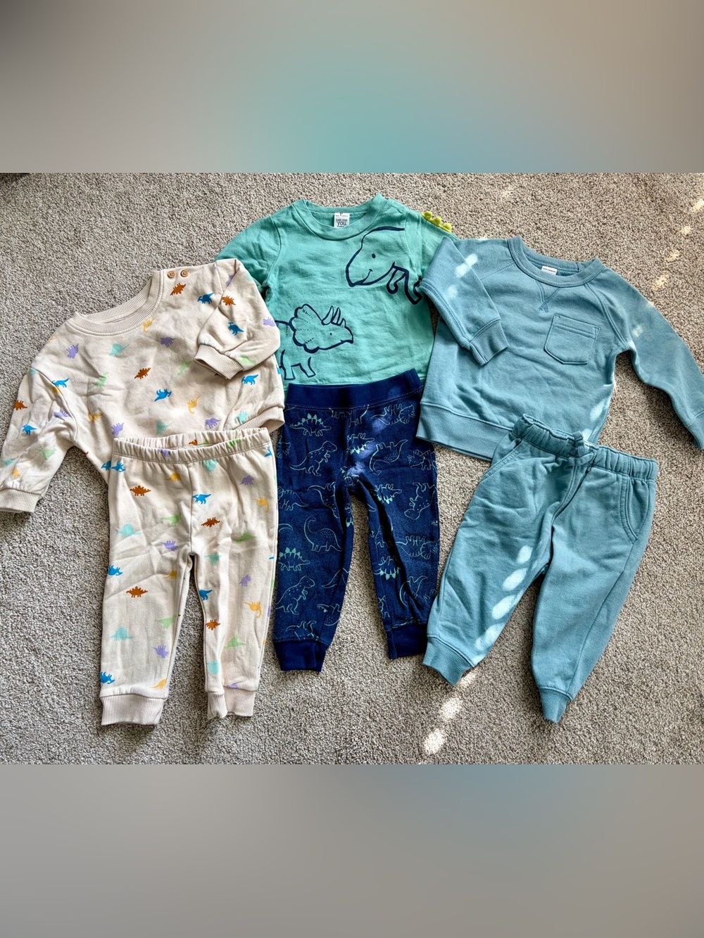 2 Baby sweatsuit sets and one long sleeve set.